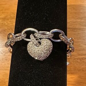 Silver Heart Charm Bracelet with white crystals encrusted on each link.